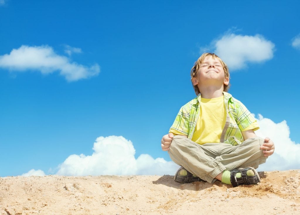 Happy Kid on a Sand Pile