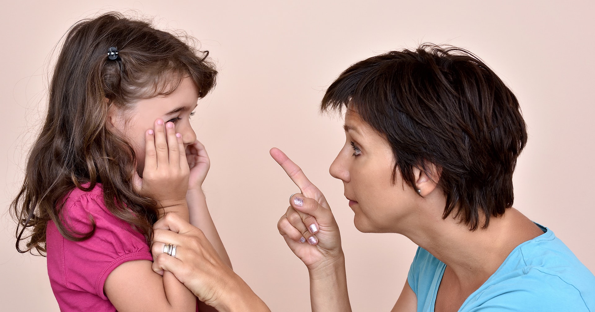 Mother scolding a daughter