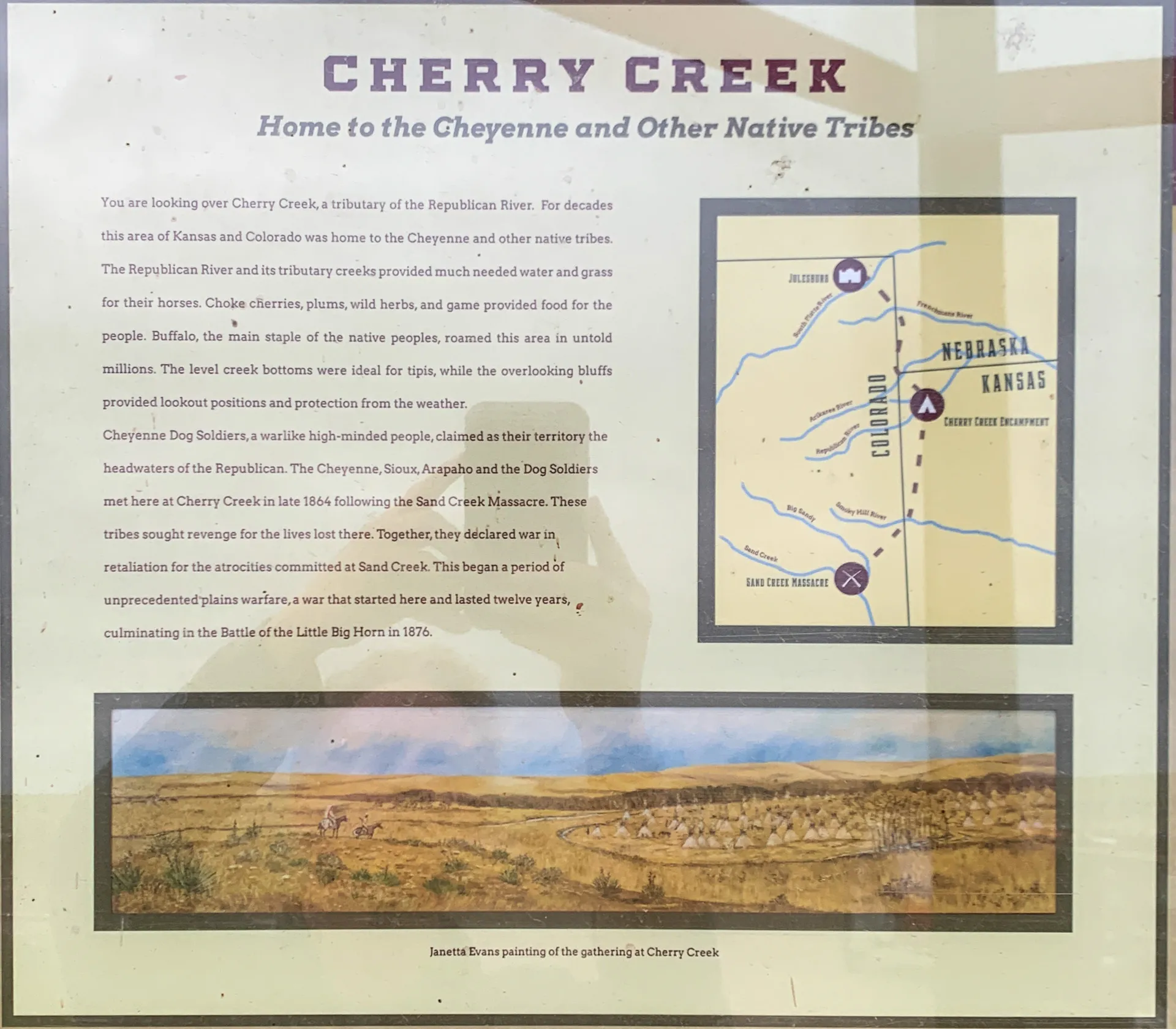Informational poster titled "Cherry Creek: Home to the Cheyenne and Other Native Tribes," featuring a map and text about the area and a painting of the landscape below.