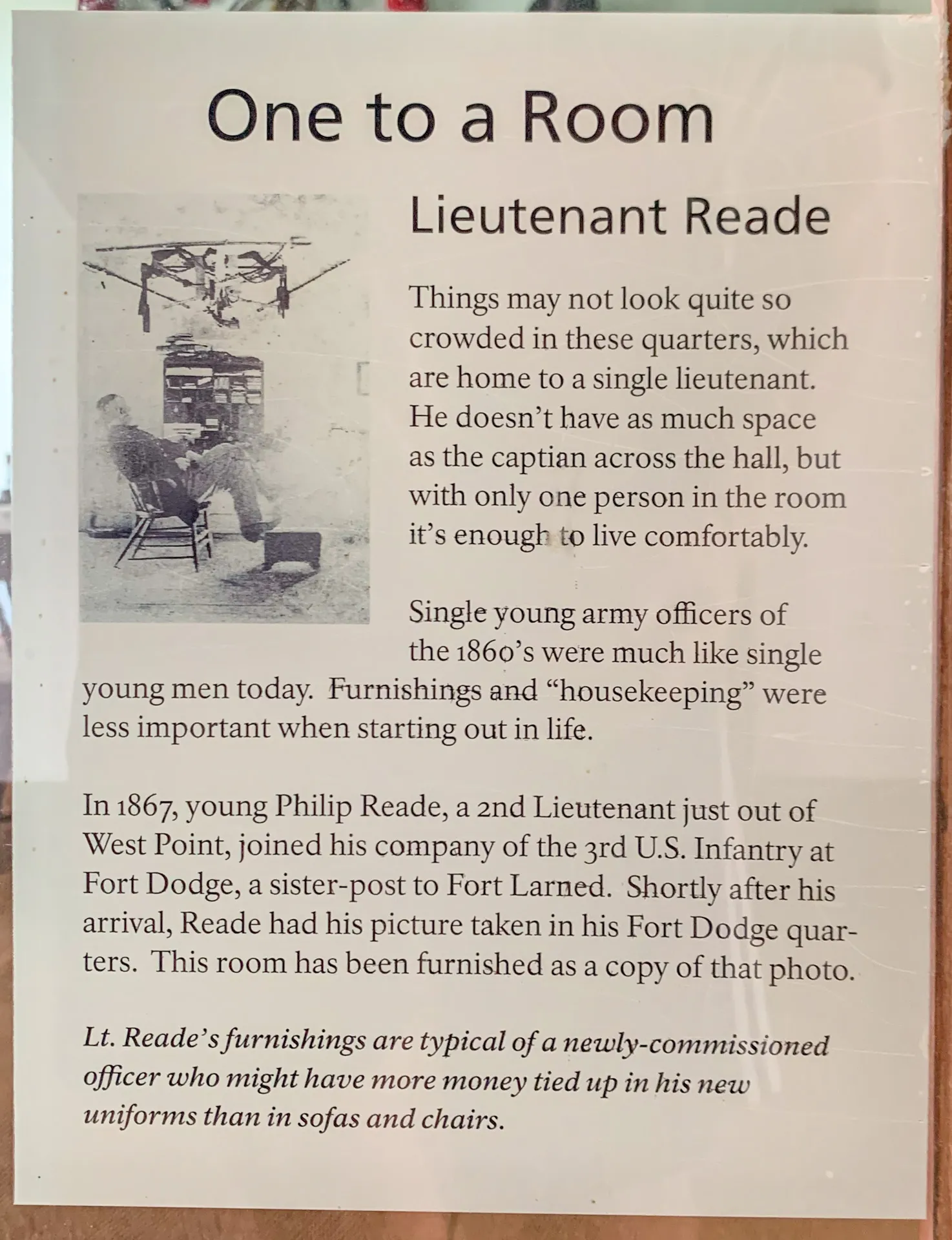 Image of a historical placard titled "One to a Room." It describes Lieutenant Read's 1860s room with sparse furnishings. Lieutenant Read, joining after West Point, prioritized uniform expenses over room decor.