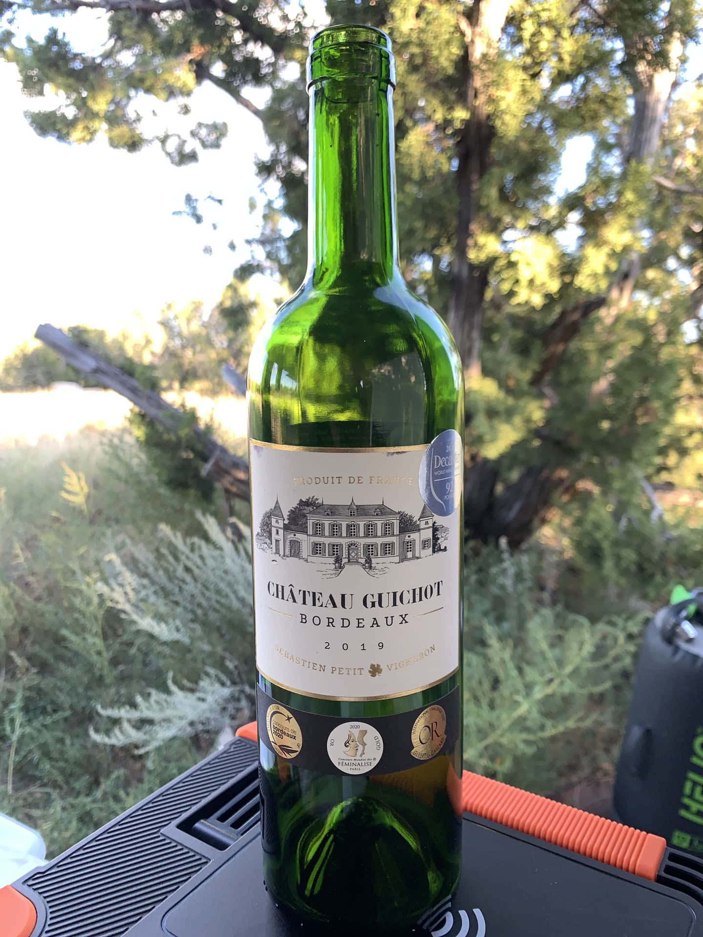 A bottle of wine sitting on a table at the Comanche National Grasslands (Withers Canyon Trailhead Campground).