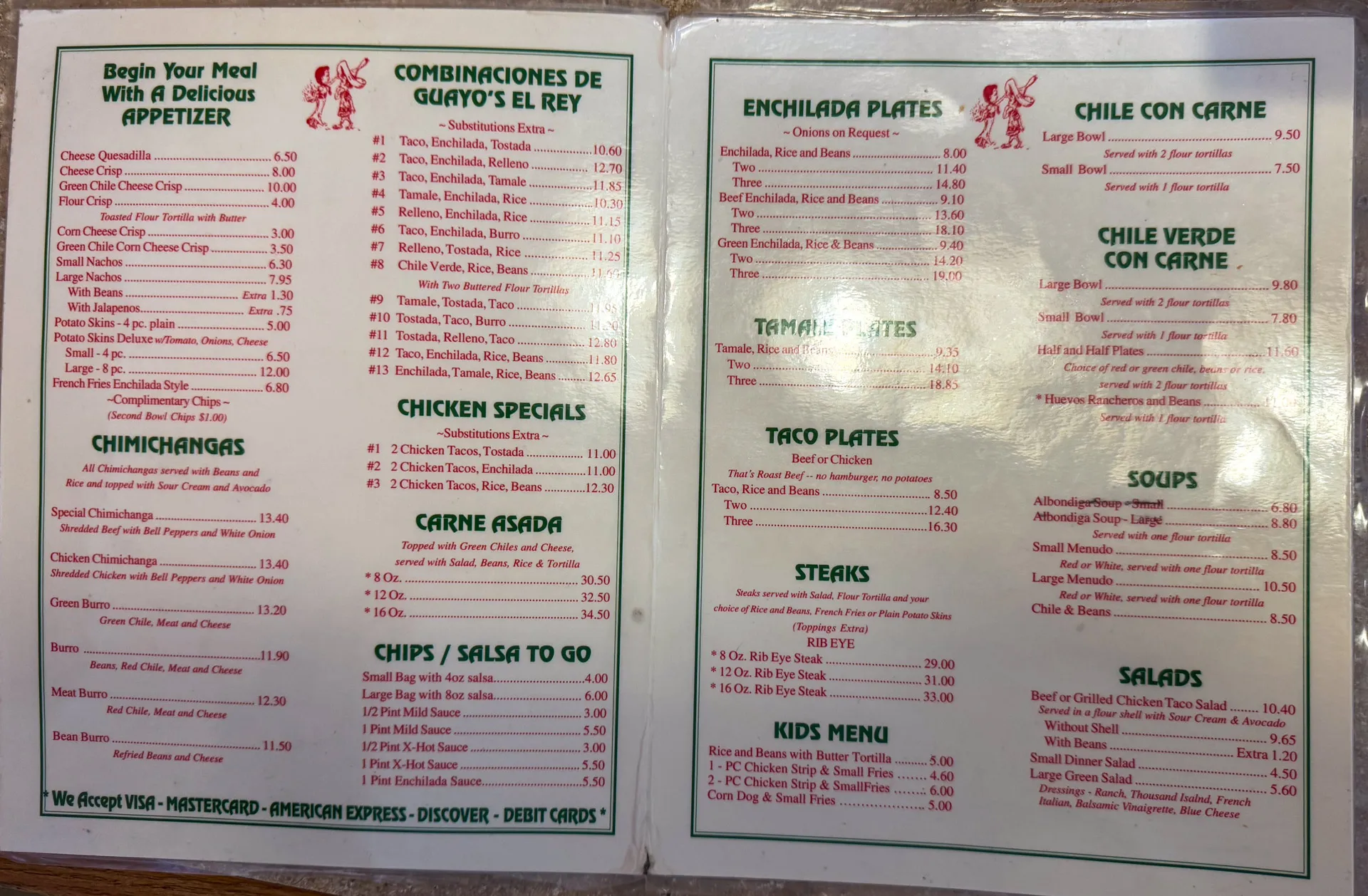 A two-page restaurant menu on light-colored paper with red and green text. The menu includes sections for appetizers, chimichangas, chicken specials, chips/salsa, combination plates, enchilada plates, tamale, taco plates, steaks, chile con carne, salads, and a kids' menu.